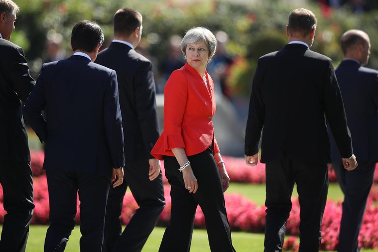 British Prime Minister Theresa May looks back as she and other leaders depart following the family photo on the second day of an informal summit of leaders of the European Union on September 20, 2018.